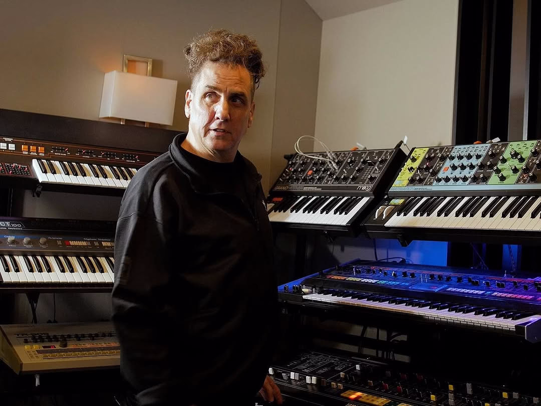Mike Dean performing live at Northwest Stadium, Landover, on August 2, 2025, alongside The Weeknd and Playboi Carti.